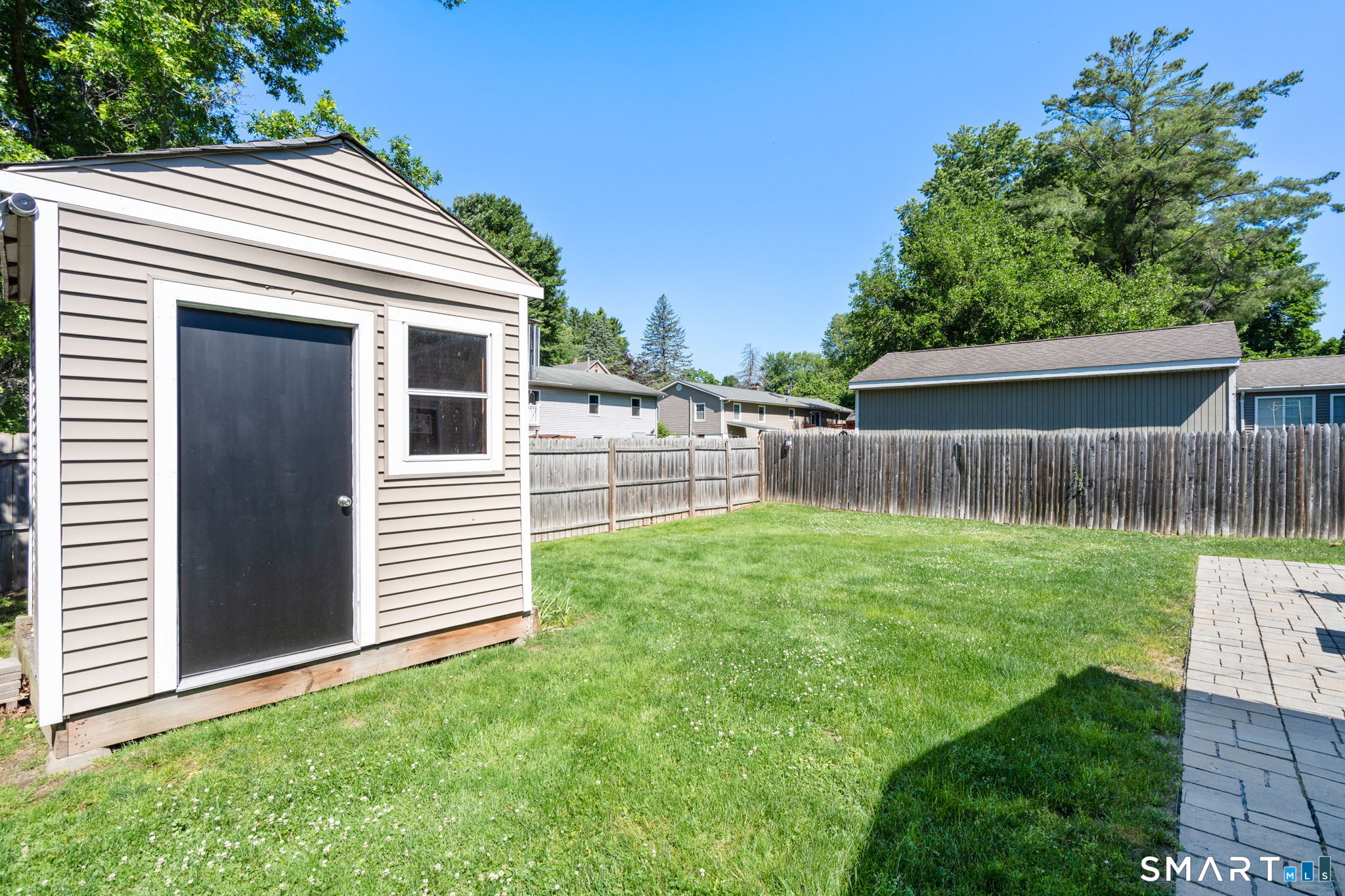 31 Cowan Street Suffield, CT 06078 - Photo 26 of 29 a view of a house with a yard