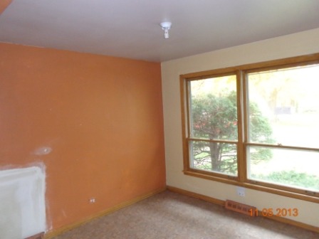 14437 Sanderson Avenue Dolton, IL 60419 - Photo 3 of 8 a view of an empty room with a window
