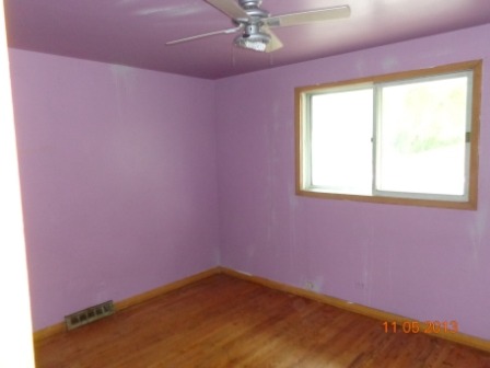 14437 Sanderson Avenue Dolton, IL 60419 - Photo 6 of 8 an empty room with a window