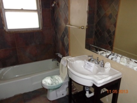 14437 Sanderson Avenue Dolton, IL 60419 - Photo 8 of 8 a bathroom with a sink toilet and a bathtub