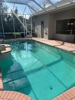 a swimming pool with patio outdoor seating and yard