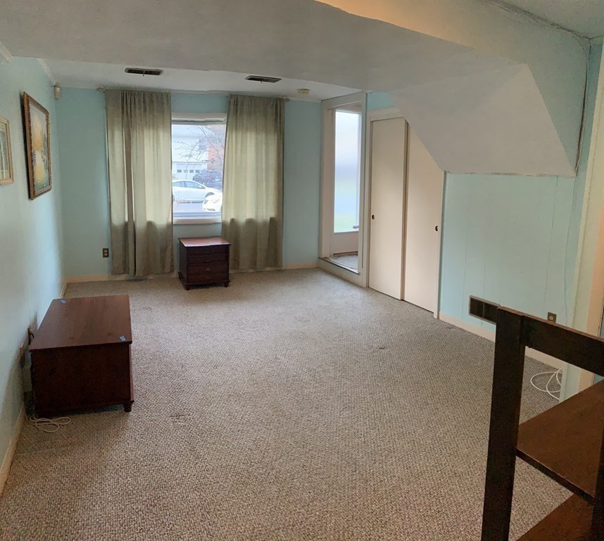 67 Joyce Road Framingham, MA 01701 - Photo 21 of 32 a living room with furniture and a window