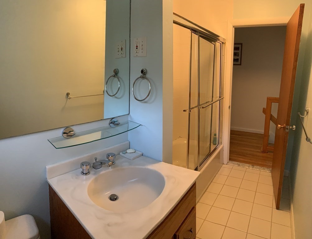 67 Joyce Road Framingham, MA 01701 - Photo 32 of 32 a bathroom with a sink and a mirror
