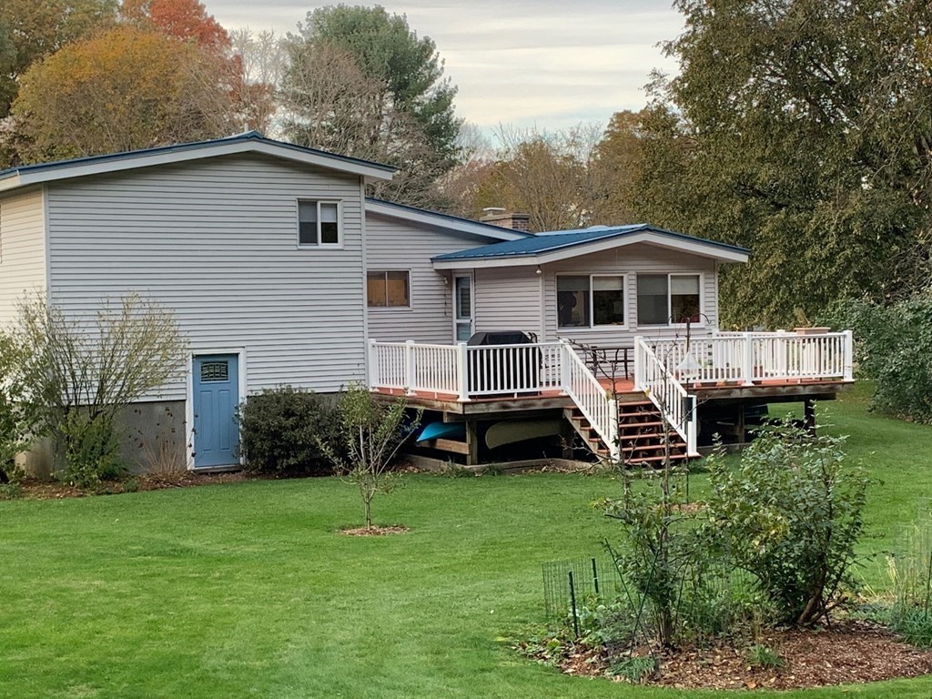 67 Joyce Road Framingham, MA 01701 - Photo 8 of 32 a front view of a house with a yard and green space