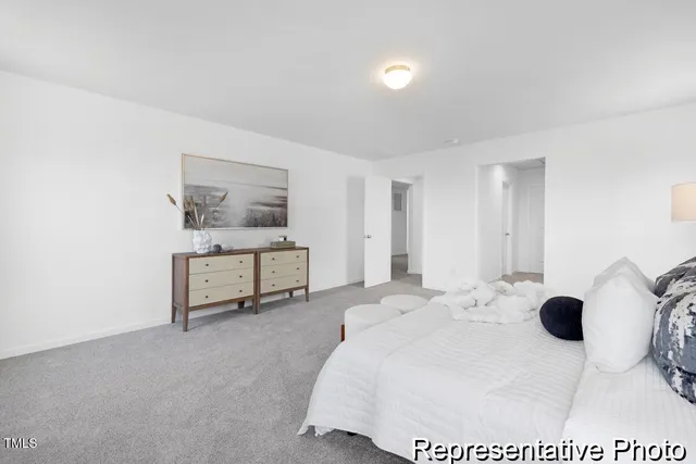 a spacious bedroom with a bed