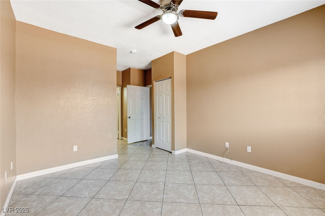 4730 East Craig Road, Unit 1005 Las Vegas, NV 89115 - Photo 27 of 45 Spare room with a ceiling fan and light tile patterned floors
