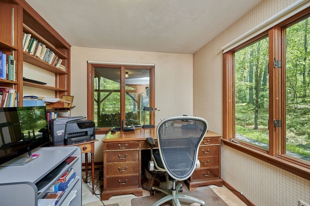 64 Cushman Road Shutesbury, MA 01002 - Photo 16 of 41 a view of a workspace with furniture and a window