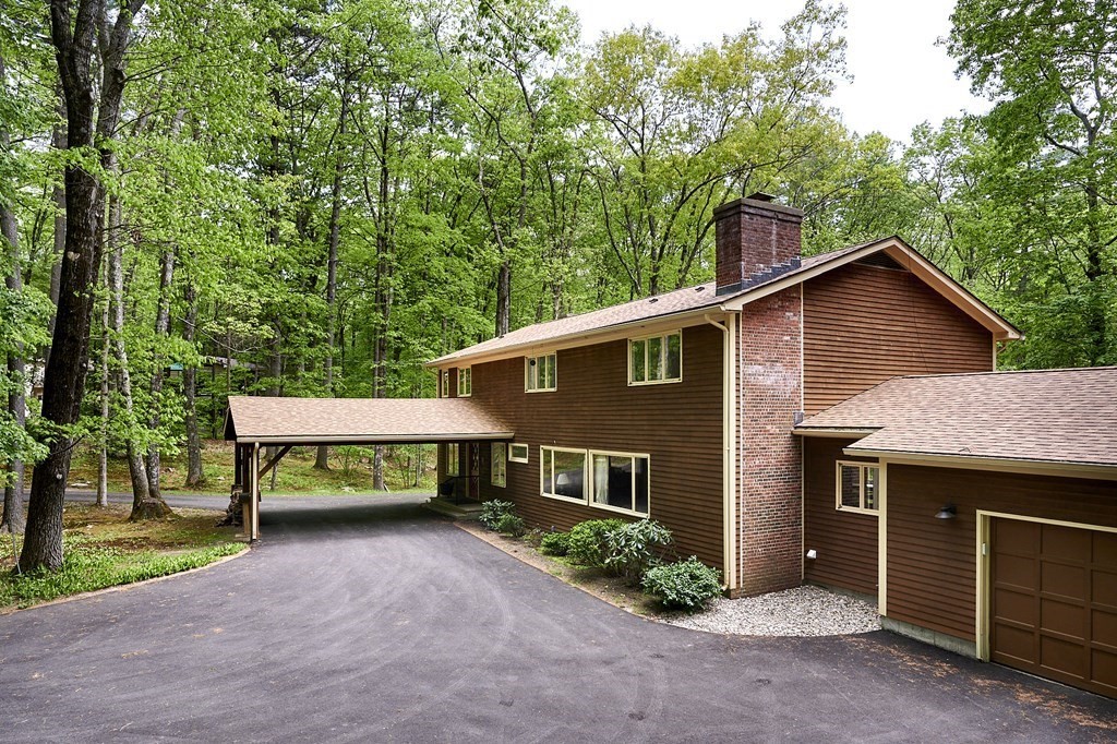 64 Cushman Road Shutesbury, MA 01002 - Photo 2 of 41 a front view of a house with a yard