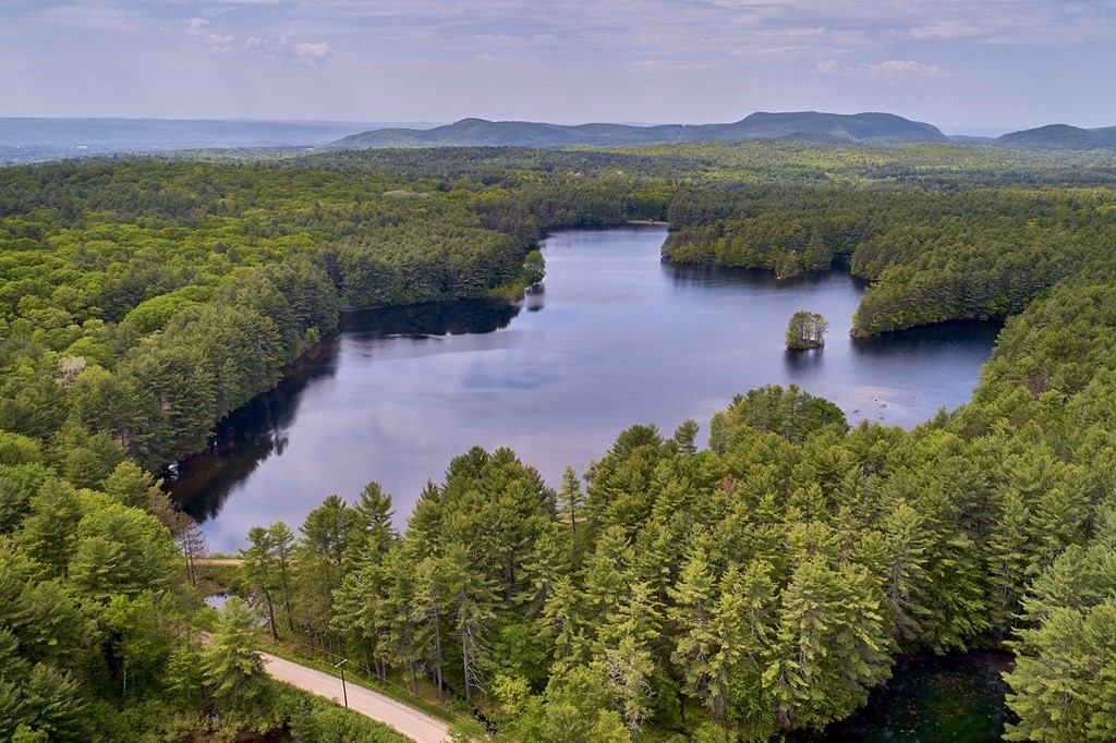 64 Cushman Road Shutesbury, MA 01002 - Photo 39 of 41 a view of lake with mountain in the background