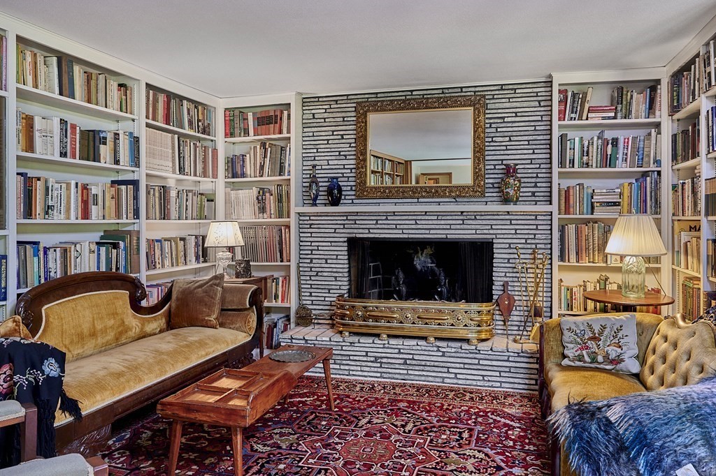 64 Cushman Road Shutesbury, MA 01002 - Photo 6 of 41 a living room with furniture and a fireplace