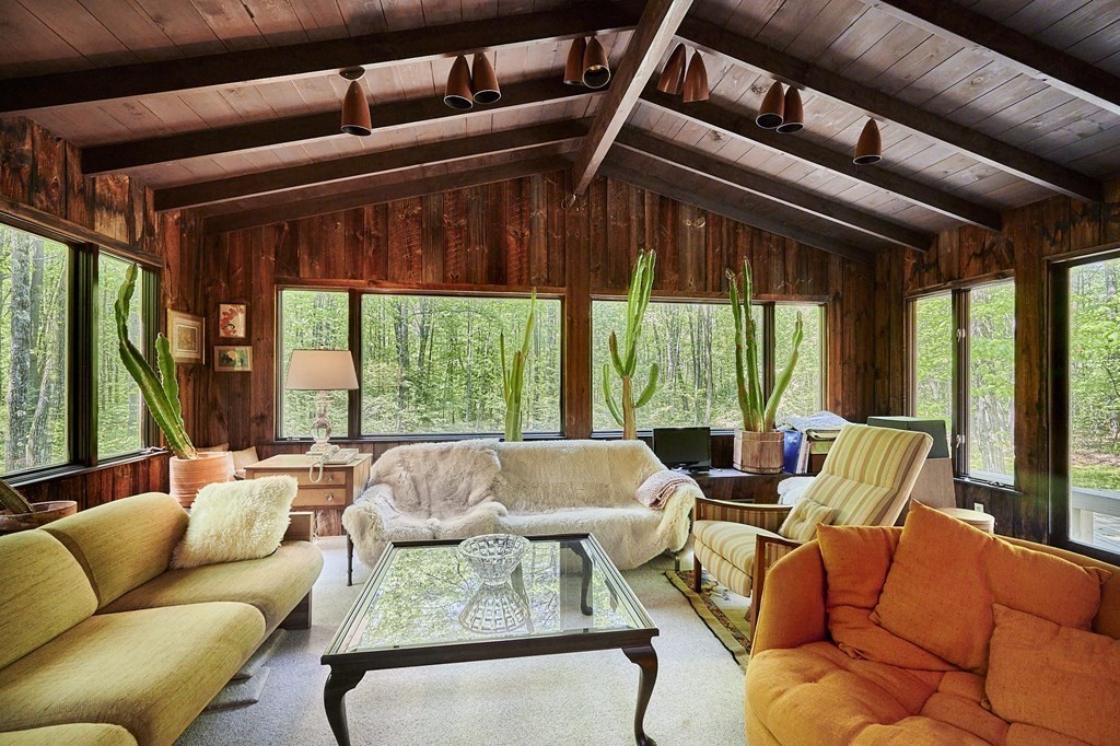 64 Cushman Road Shutesbury, MA 01002 - Photo 8 of 41 a living room with furniture and floor to ceiling windows