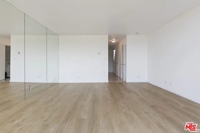 a kitchen with stainless steel appliances a refrigerator sink and stove