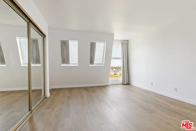 a bathroom with a shower and a sink