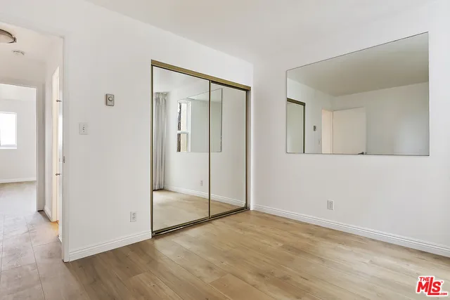 a view of a pathway with a house in the background