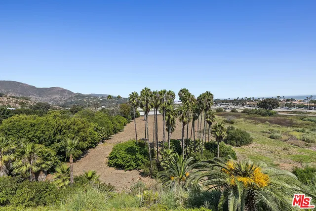 a view of a city with mountains in the background