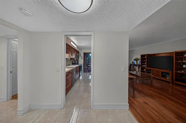 a view of a livingroom with furniture and a flat screen tv