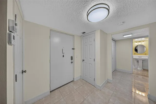a view of a bathroom with a shower and a sink