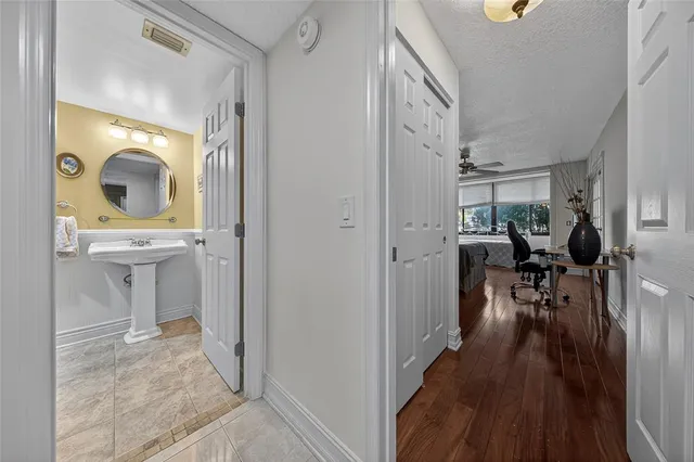 a view of living room and wooden floor