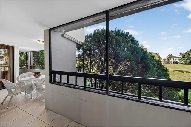 a view of a porch with a floor to ceiling windows