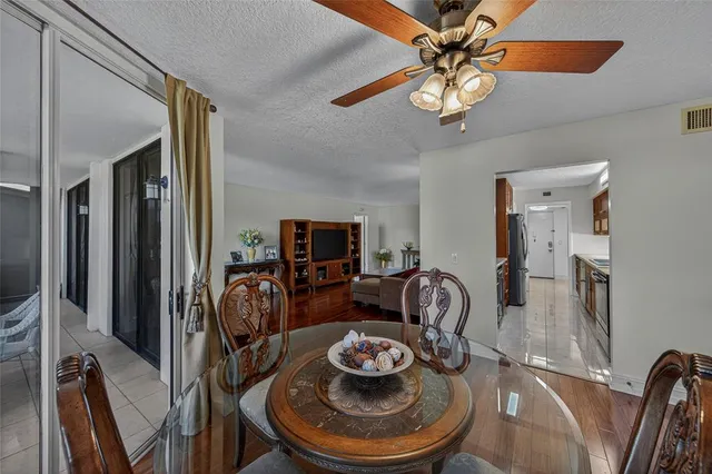 a dining room with furniture and a chandelier