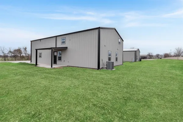 a view of a backyard with garden