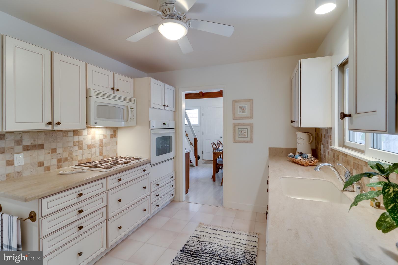 26 Short Road Bethany Beach, DE 19930 - Photo 15 of 63 Kitchen opens to Screened Porch