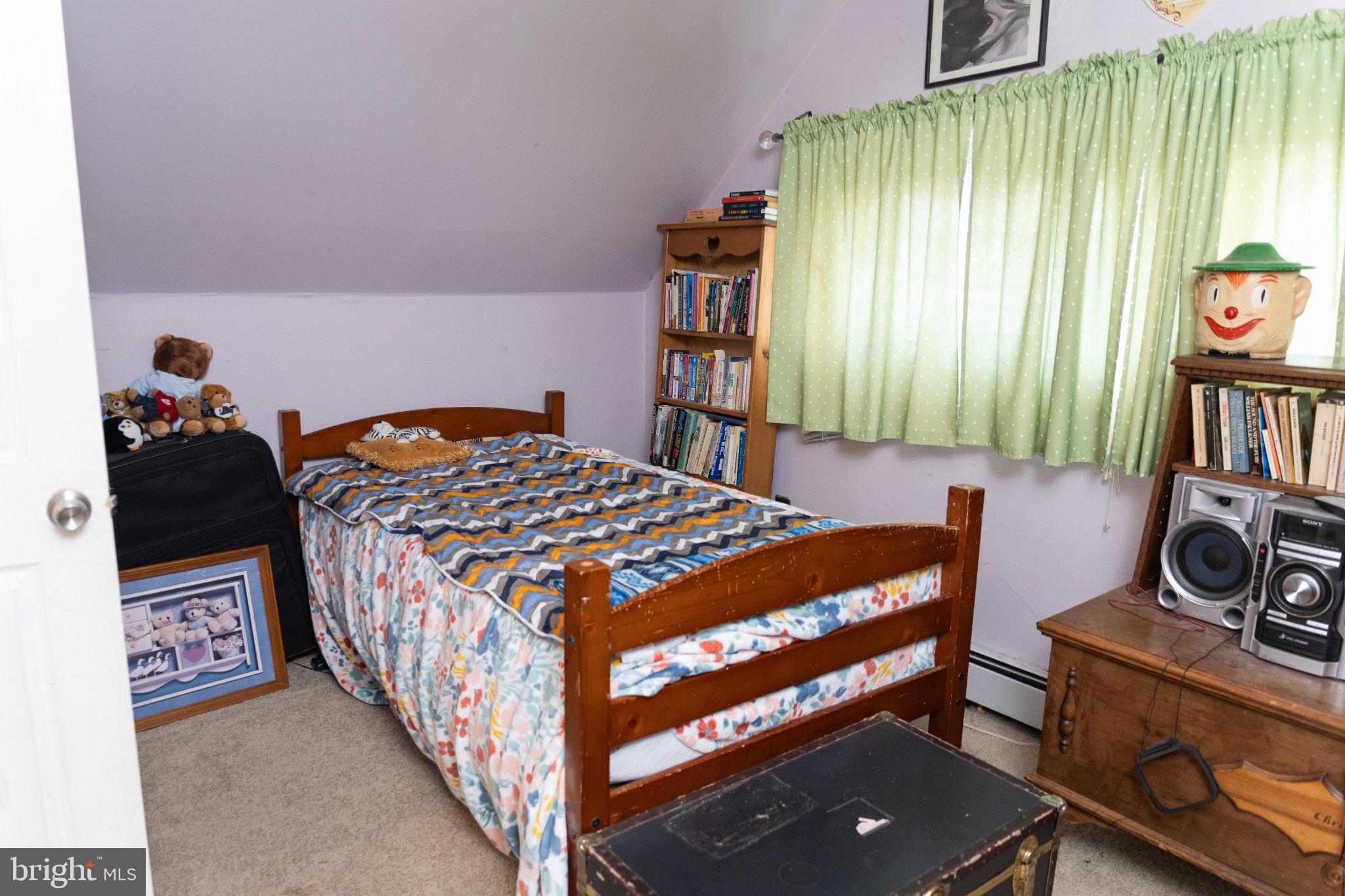 26 Plumtree Road Levittown, PA 19056 - Photo 13 of 16 Cozy attic bedroom with vintage charm.