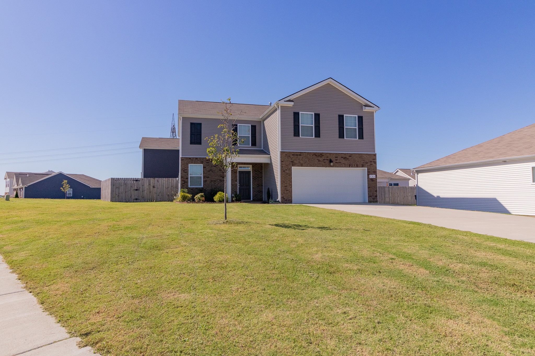753 Prominence Road Columbia, TN 38401 - Photo 1 of 37 a front view of a house with a yard and garage