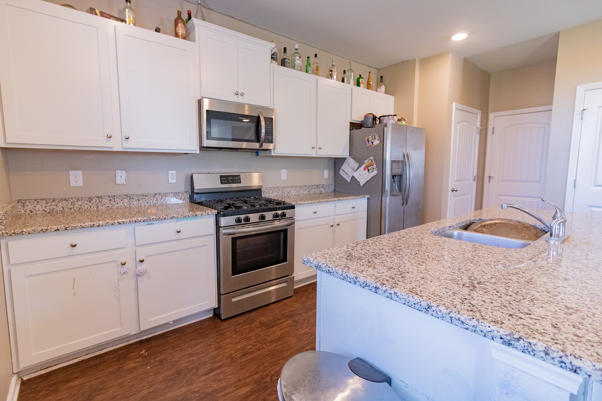753 Prominence Road Columbia, TN 38401 - Photo 16 of 37 a kitchen with stainless steel appliances granite countertop a stove a sink and a refrigerator