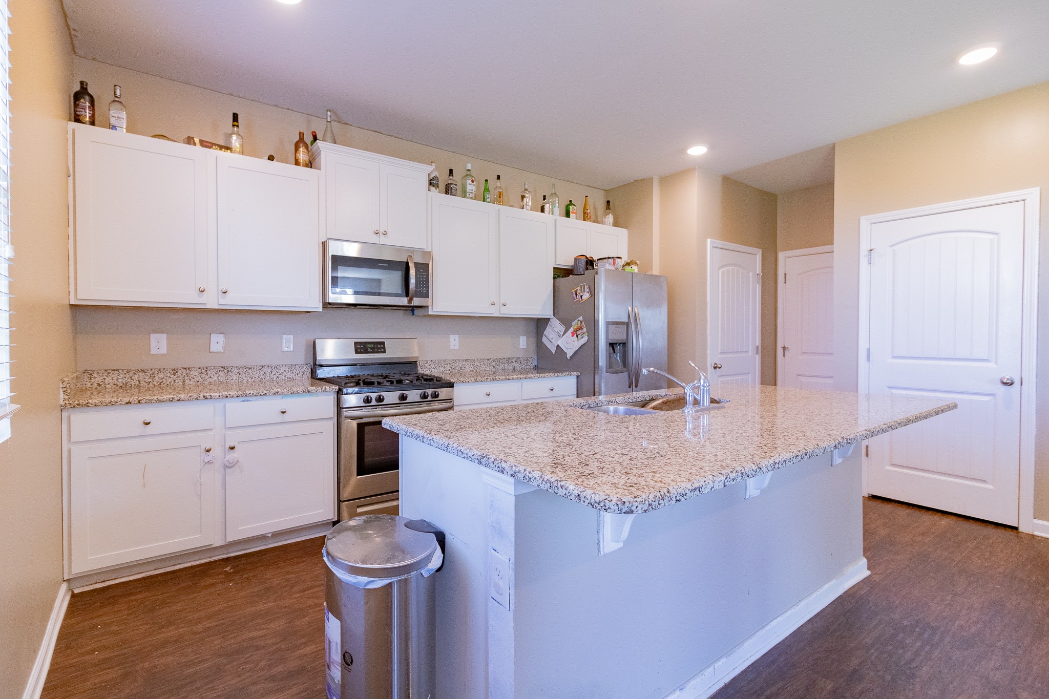 753 Prominence Road Columbia, TN 38401 - Photo 17 of 37 a kitchen with stainless steel appliances granite countertop a sink stove and cabinets