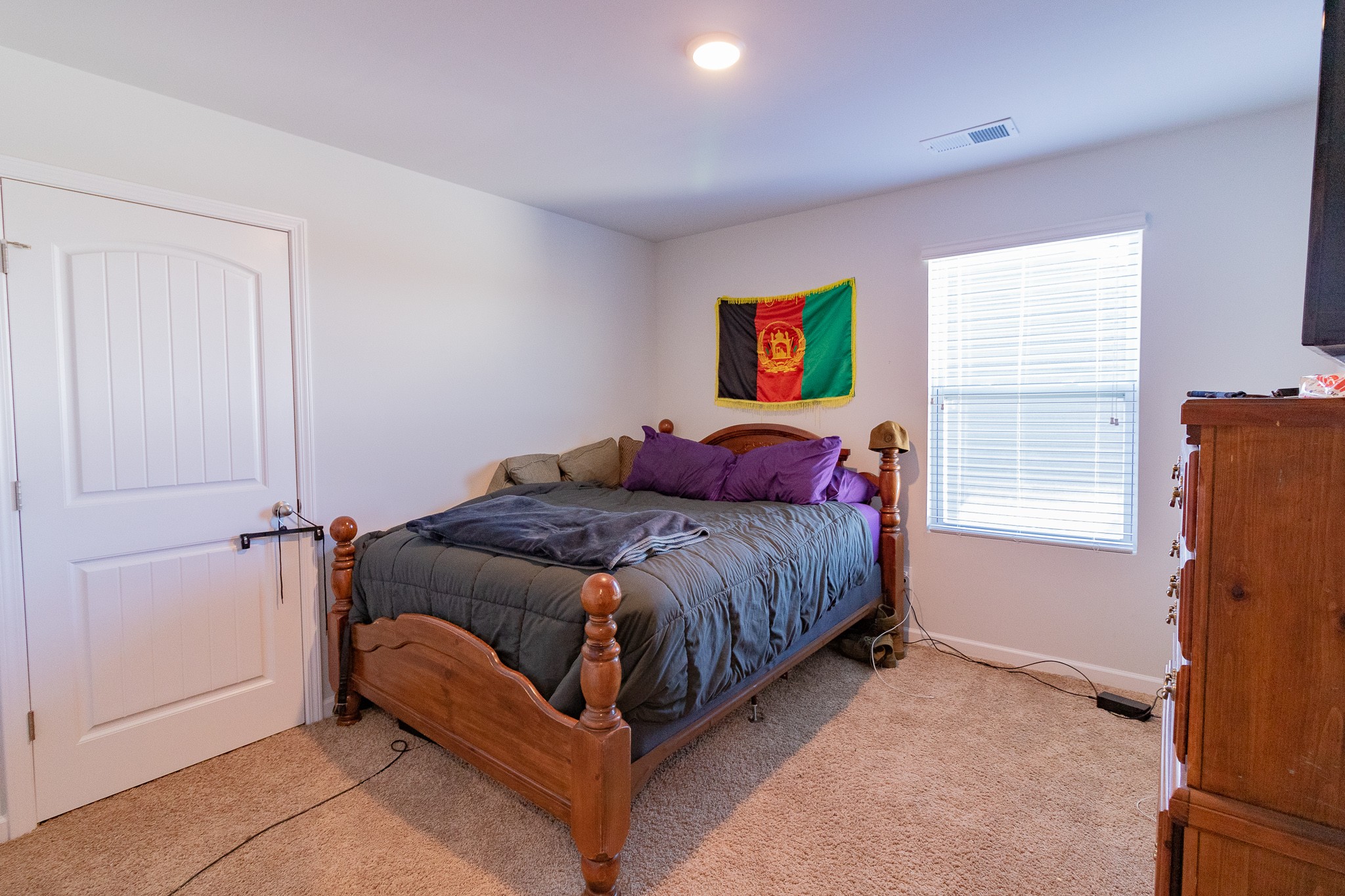 753 Prominence Road Columbia, TN 38401 - Photo 30 of 37 a spacious bedroom with a bed and wooden floor