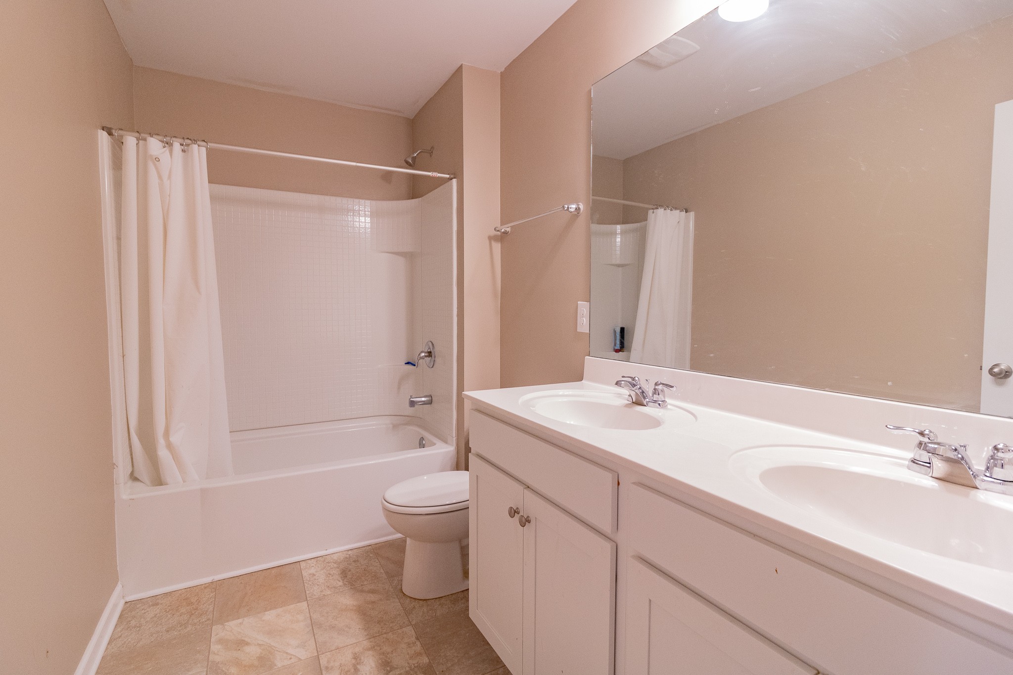 753 Prominence Road Columbia, TN 38401 - Photo 34 of 37 a bathroom with a double vanity sink toilet mirror and shower