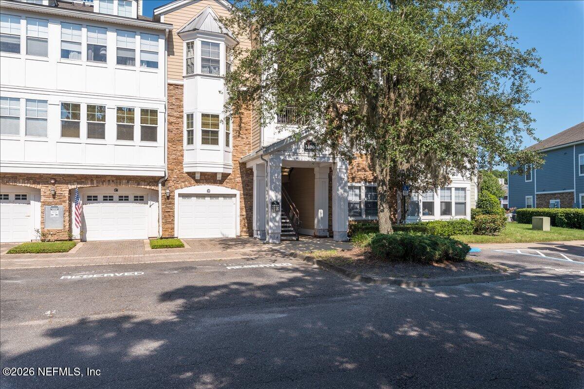 8550 Touchton Road, Unit 1437 Jacksonville, FL 32216 - Photo 2 of 36 a front view of a building with a street