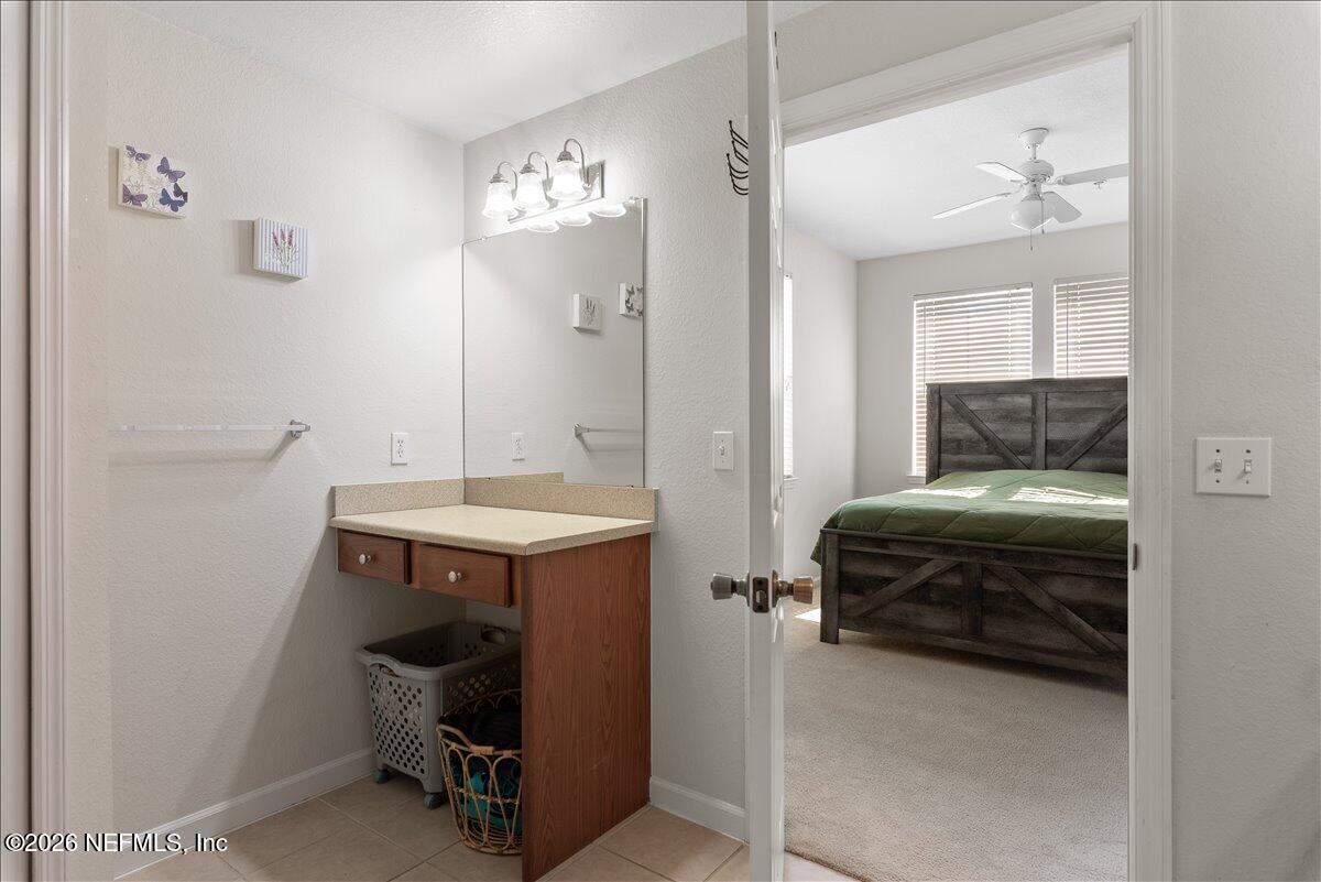 8550 Touchton Road, Unit 1437 Jacksonville, FL 32216 - Photo 22 of 36 a bedroom with a bed and a table
