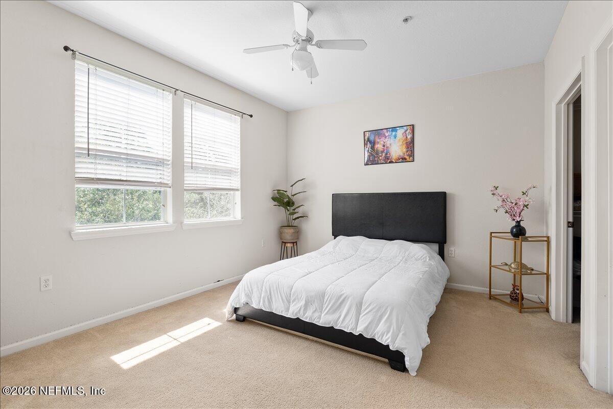 8550 Touchton Road, Unit 1437 Jacksonville, FL 32216 - Photo 23 of 36 a bedroom with a bed and a window