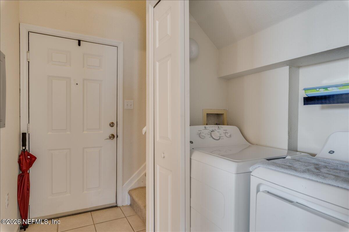 8550 Touchton Road, Unit 1437 Jacksonville, FL 32216 - Photo 29 of 36 a utility room with dryer and washer