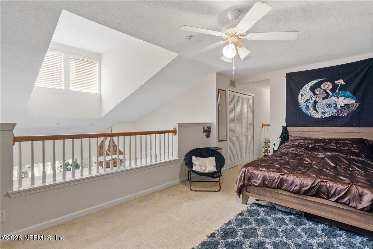 8550 Touchton Road, Unit 1437 Jacksonville, FL 32216 - Photo 30 of 36 a bedroom with bed and a window
