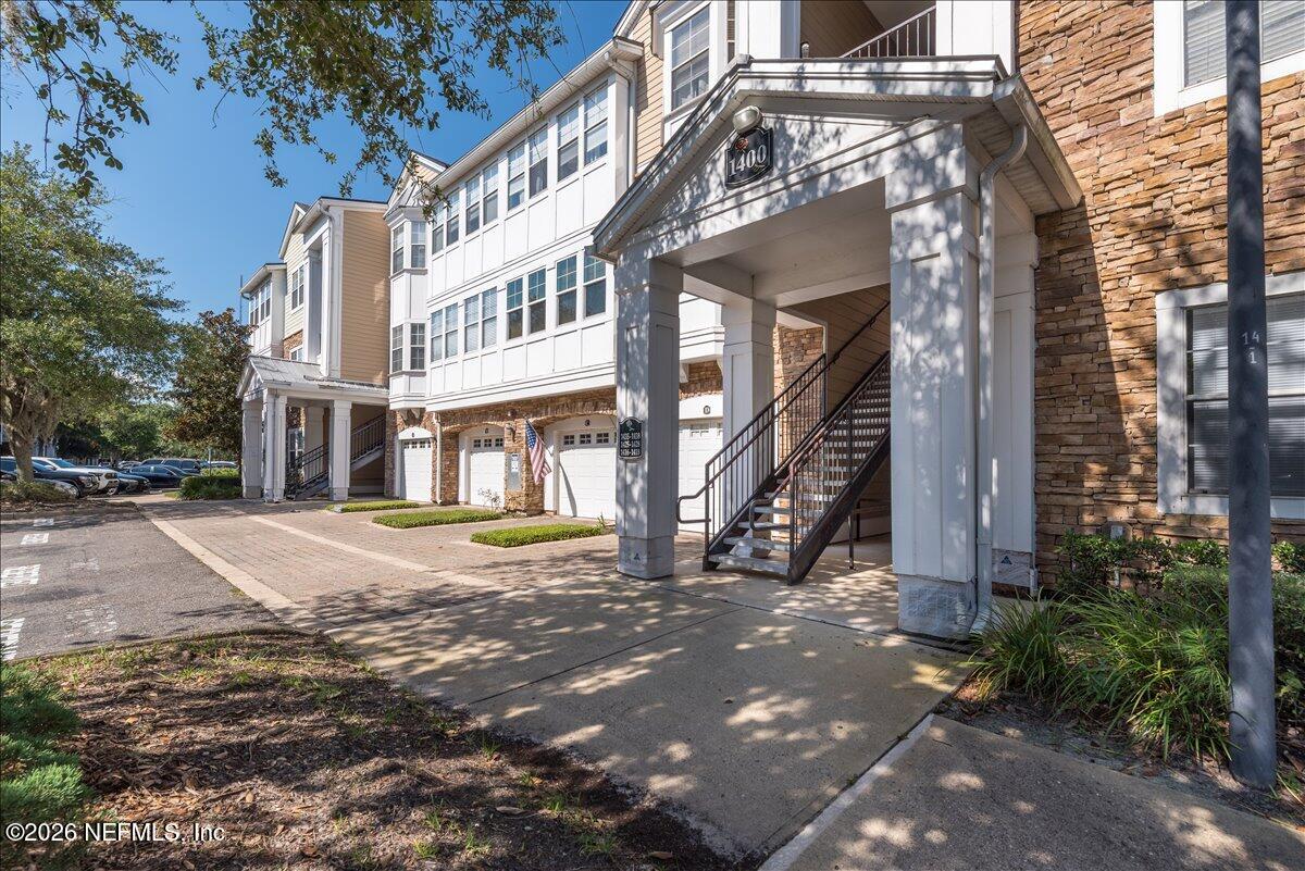 8550 Touchton Road, Unit 1437 Jacksonville, FL 32216 - Photo 31 of 36 a view of a big building with many windows