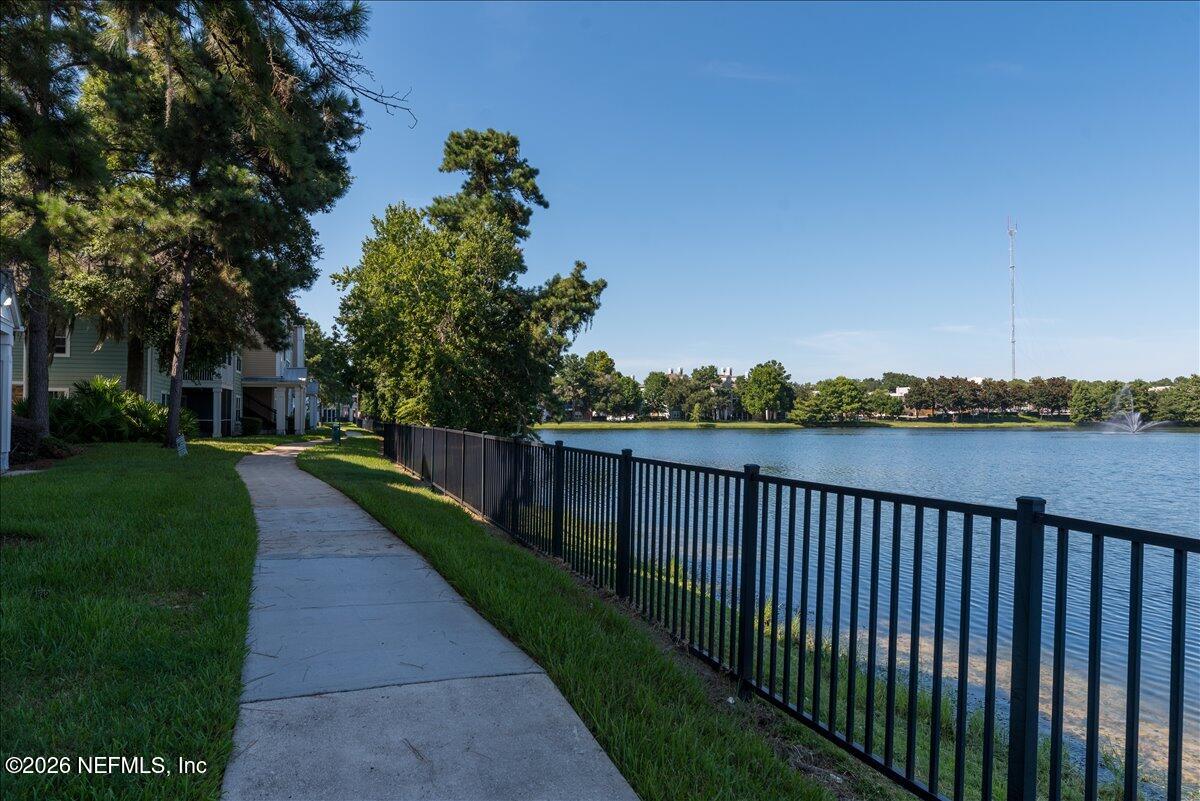 8550 Touchton Road, Unit 1437 Jacksonville, FL 32216 - Photo 33 of 36 a view of a balcony with wooden fence