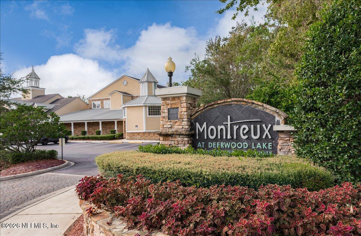 8550 Touchton Road, Unit 1437 Jacksonville, FL 32216 - Photo 34 of 36 a view of a house with a yard