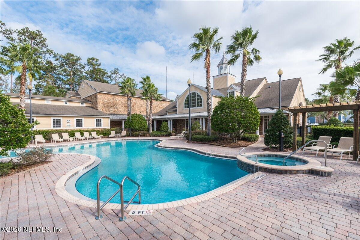 8550 Touchton Road, Unit 1437 Jacksonville, FL 32216 - Photo 35 of 36 a view of a swimming pool with lounge chairs