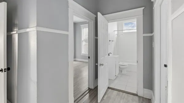 a bathroom with a granite countertop sink