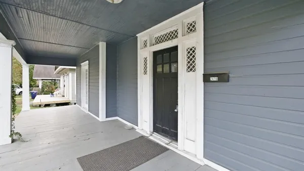 a view of a hallway with a outdoor space