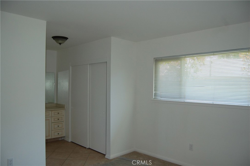 8484 Monteel Place Riverside, CA 92504 - Photo 18 of 34 a view of an empty room with a window