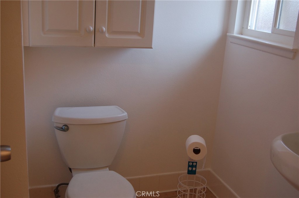 8484 Monteel Place Riverside, CA 92504 - Photo 20 of 34 a white toilet sitting next to a window