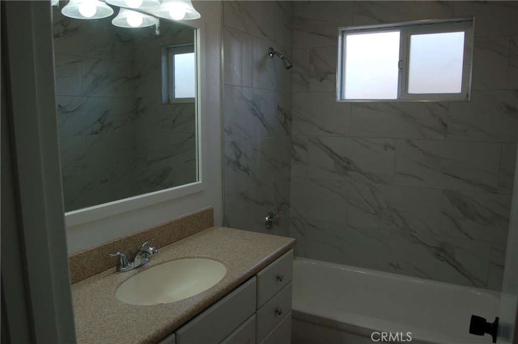 8484 Monteel Place Riverside, CA 92504 - Photo 21 of 34 a bathroom with a granite countertop sink toilet and shower