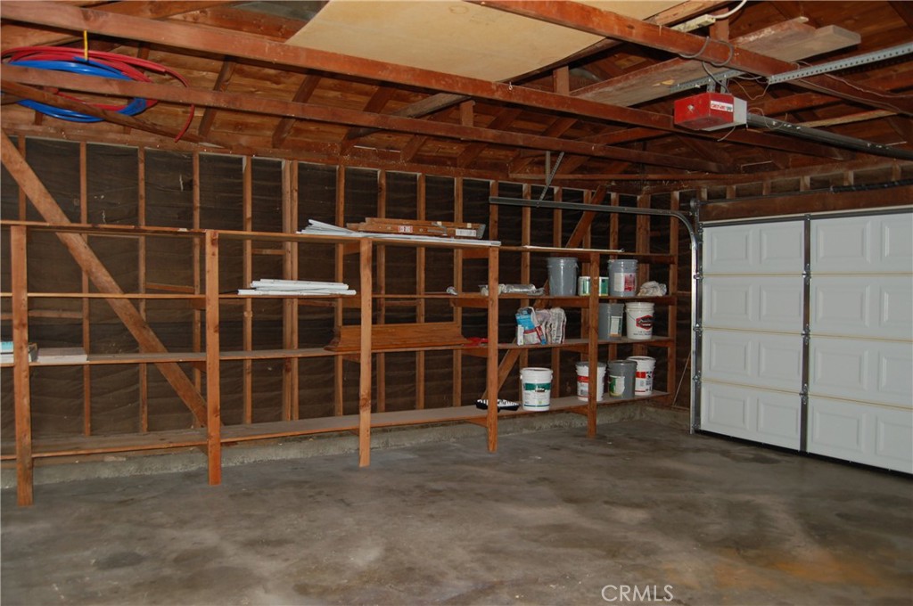 8484 Monteel Place Riverside, CA 92504 - Photo 31 of 34 a view of a wooden shelves