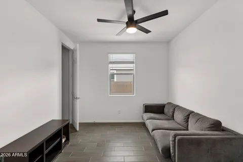 a living room with furniture and a window