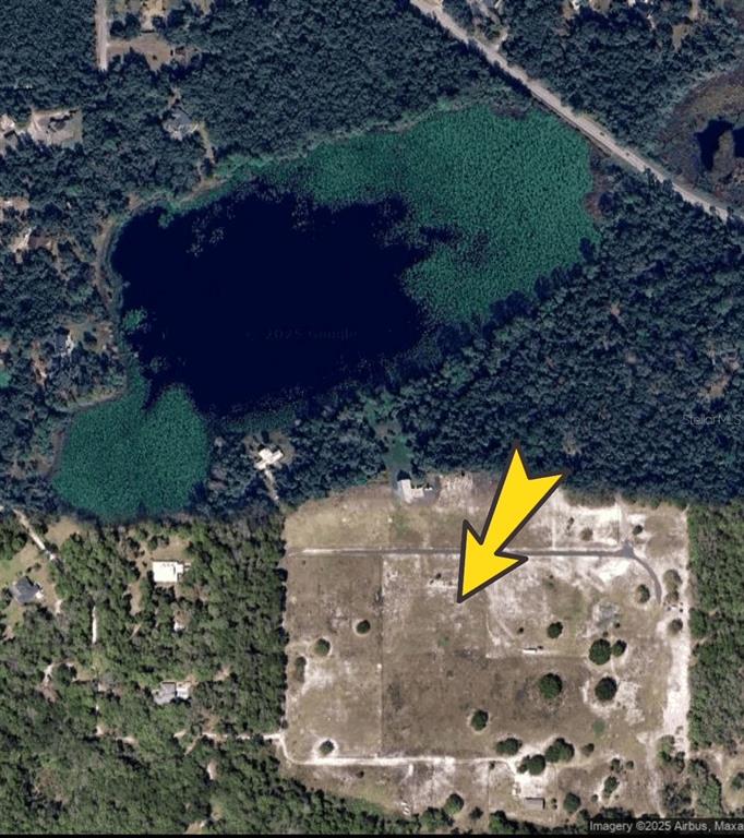 Old Titusville Road Deltona, FL 32725 - Photo 3 of 5 a view of swimming pool outdoor seating area and green space