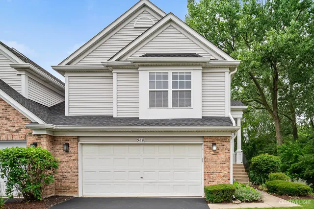 a front view of a house with a garage